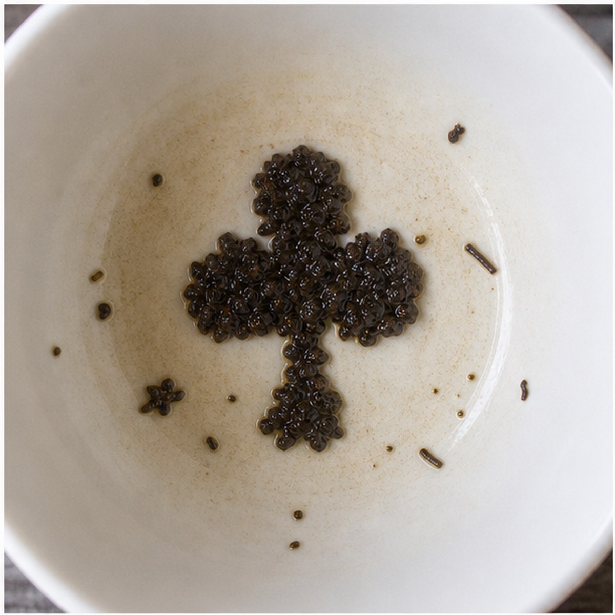 Clubs tea leaf reading cup example