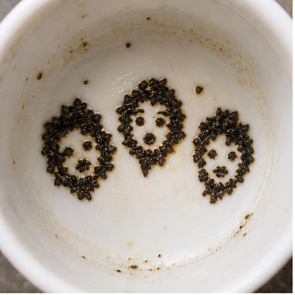 Faces tea leaf reading cup example