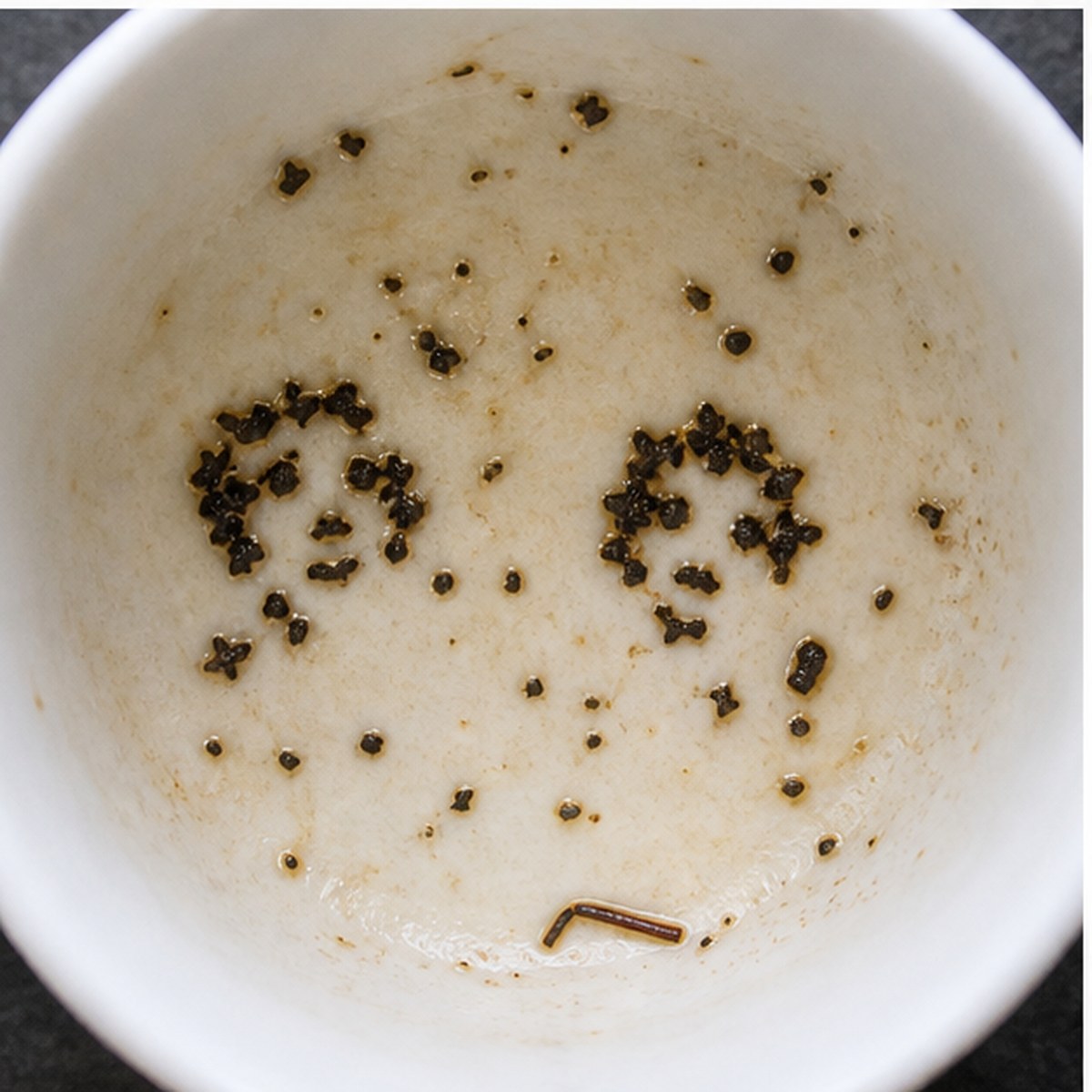 Faces tea leaves cup variation two