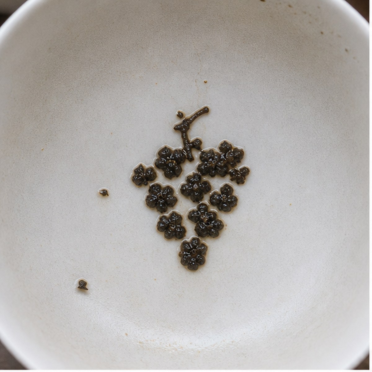 Grapes tea leaf reading cup example