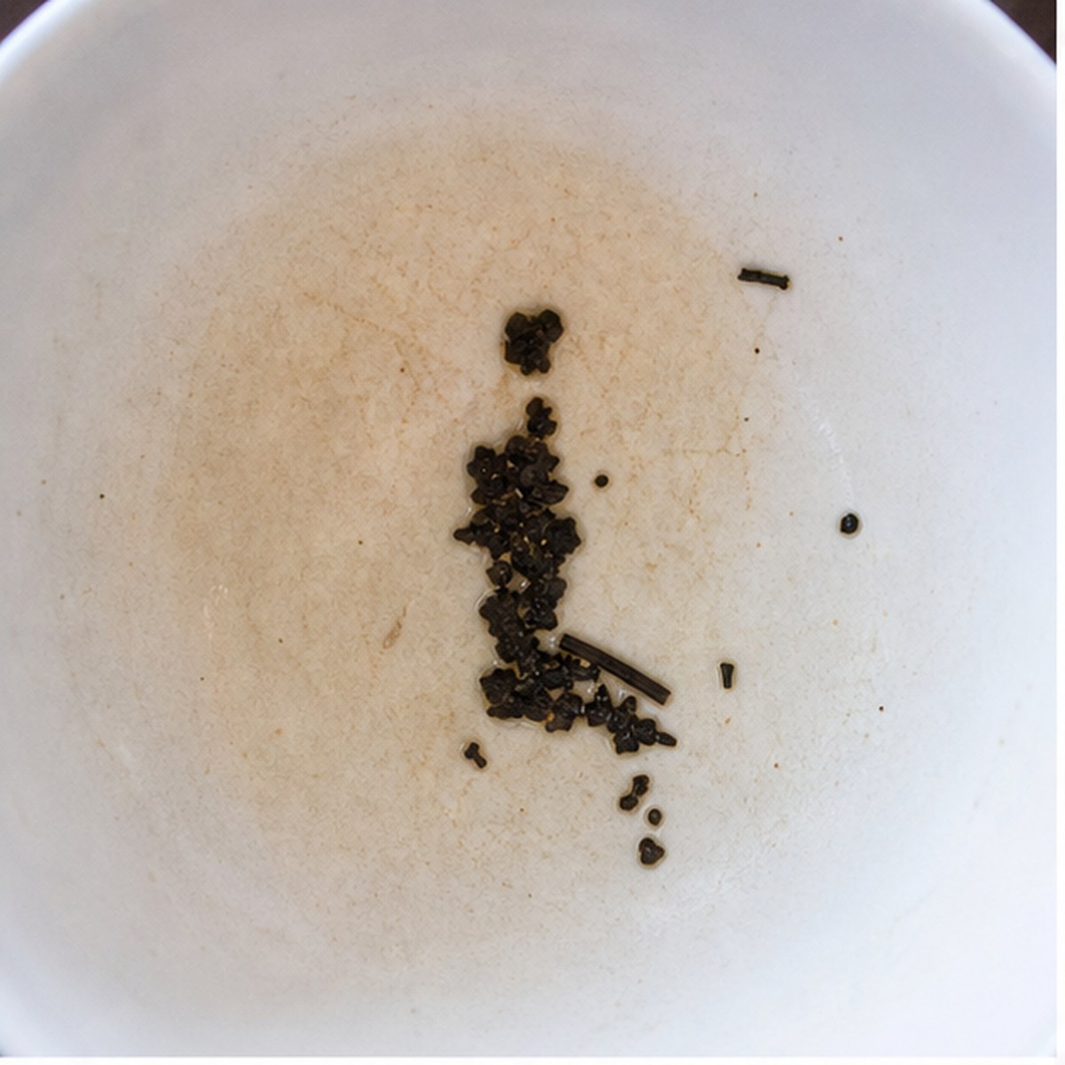 Kneeling Figure tea leaf reading cup example